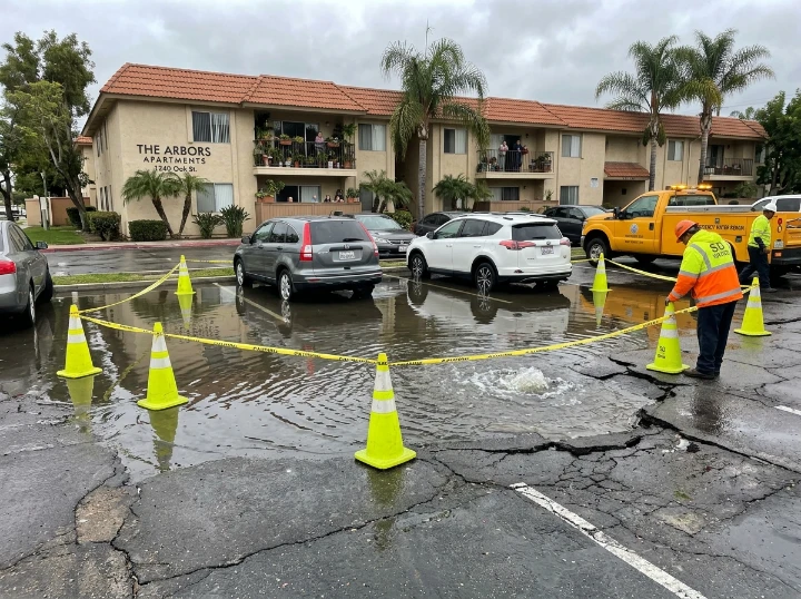 Before: Asphalt Water Eruption - Cedar Avenue Multi-Family Main Supply Rupture