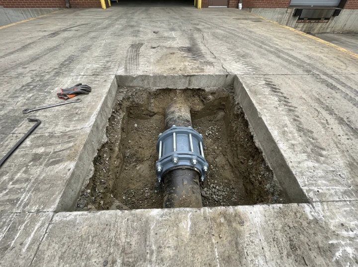 After: Precision Concrete Apron Spot Repair - Renaissance Marketplace Commercial Fire Riser Line
